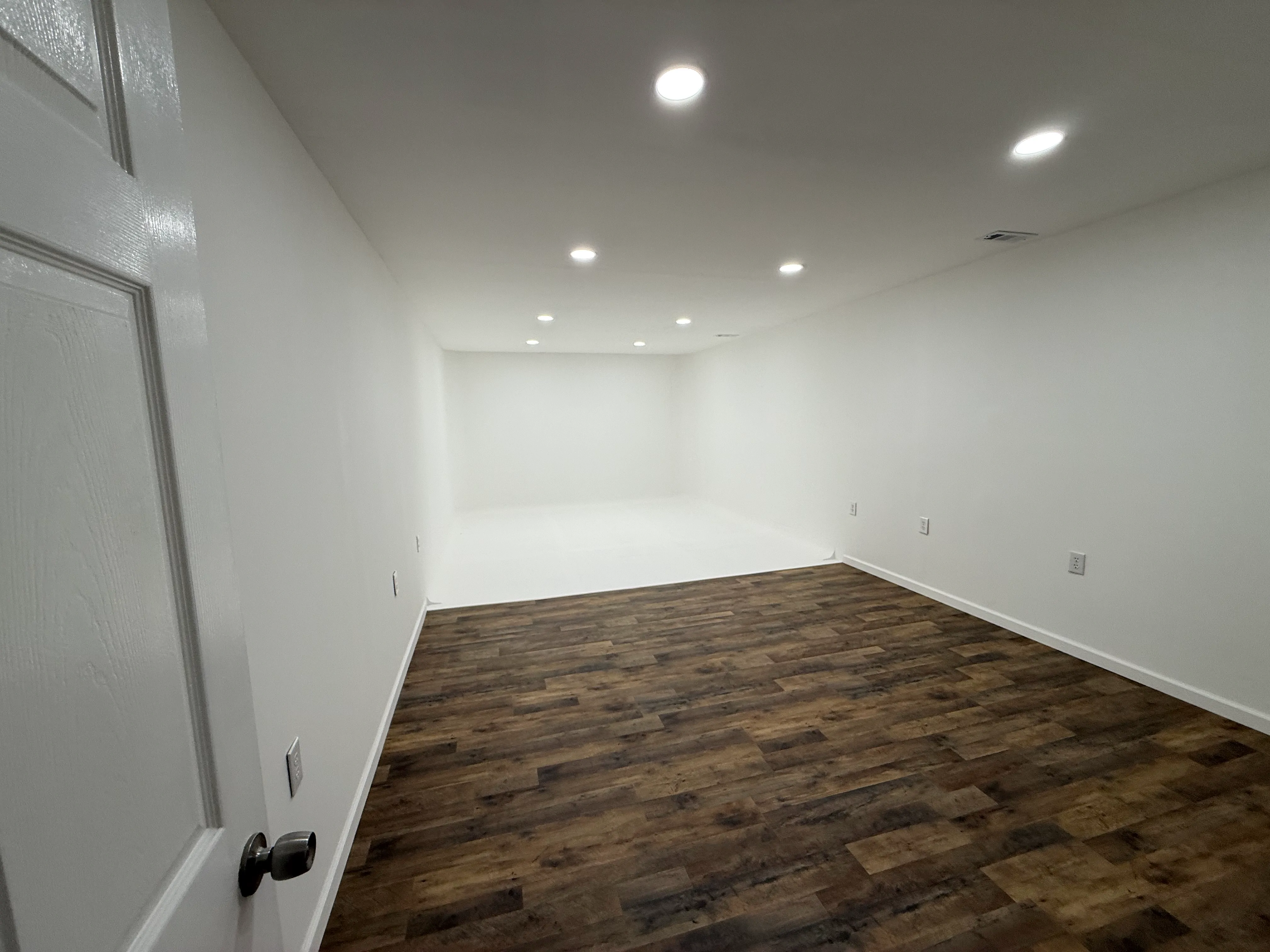 Interior of White Heaven photo studio with white cyc wall